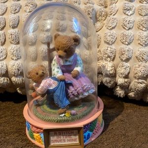 Bear figurine.  A stitch in time saves nine.